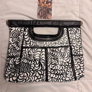Hand panted one of a kind black and white clutch purse.